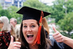 Recent graduate with cap and gown. Student Loan Debt Consolidation